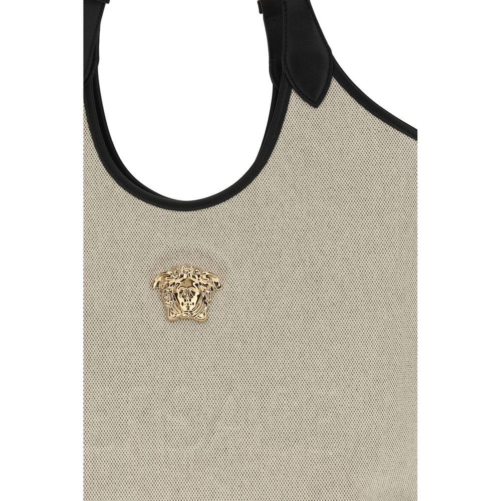 Beige textured designer shoulder bag with black trim and gold Medusa head emblem