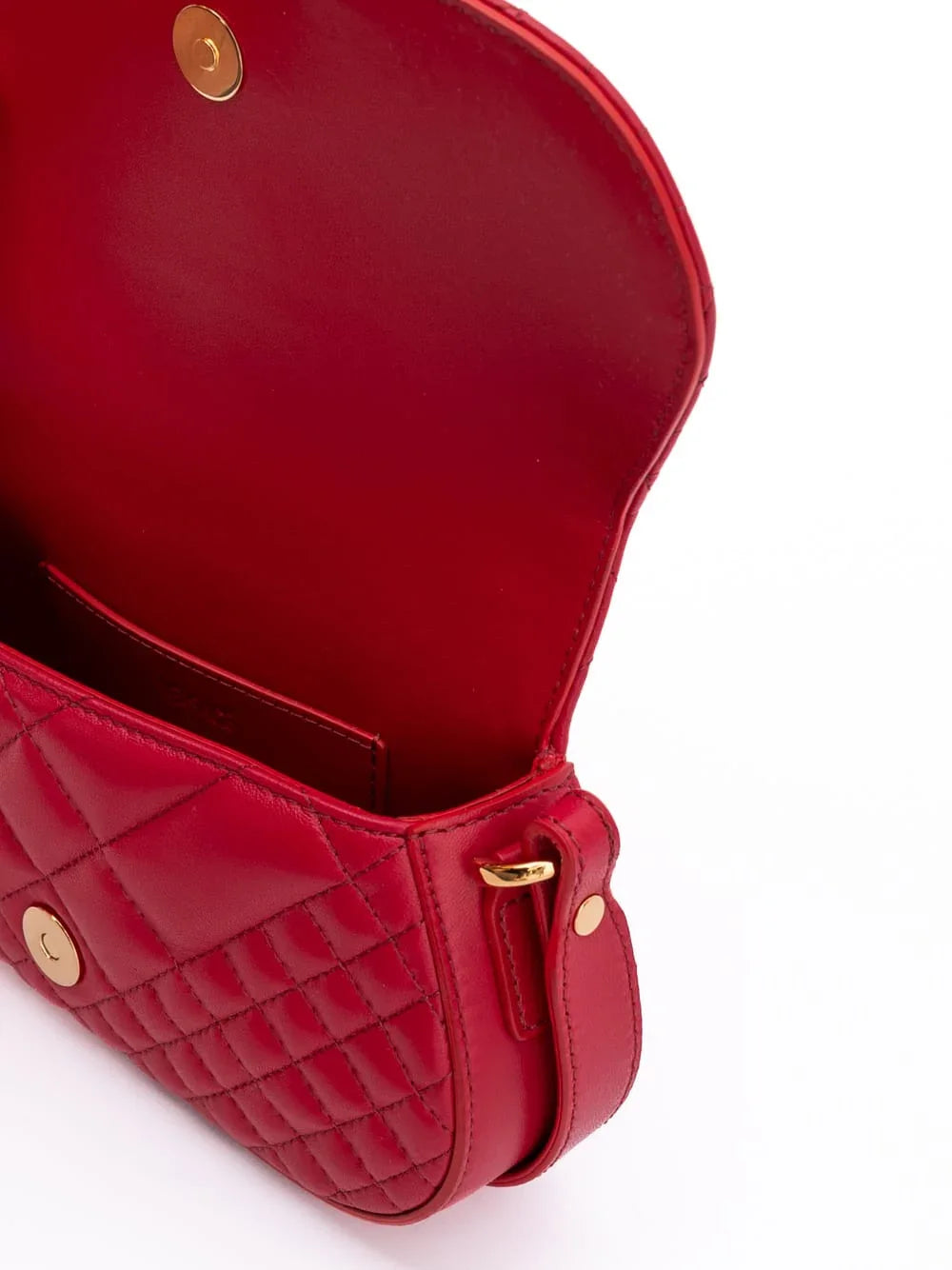 Open red quilted leather crossbody bag with gold magnetic closure on white background