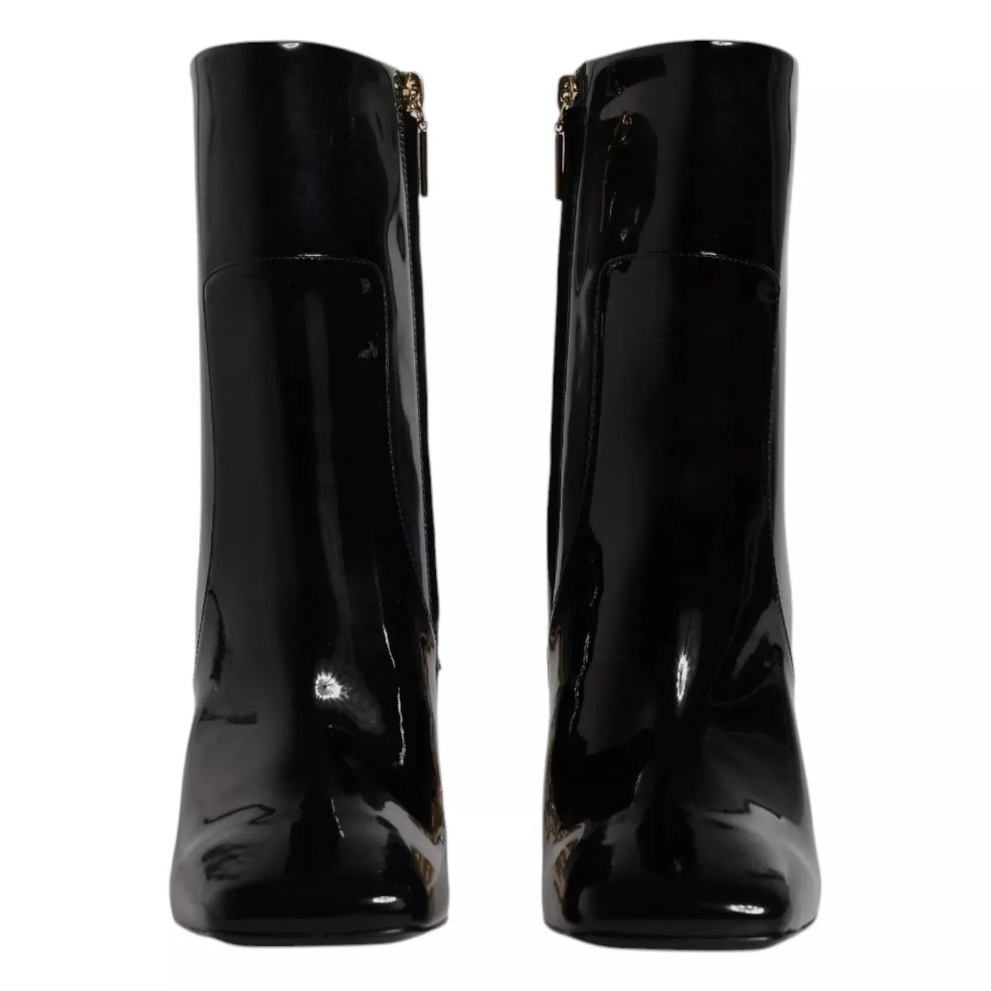 Black patent leather ankle boots with square toes and gold side zippers, front view