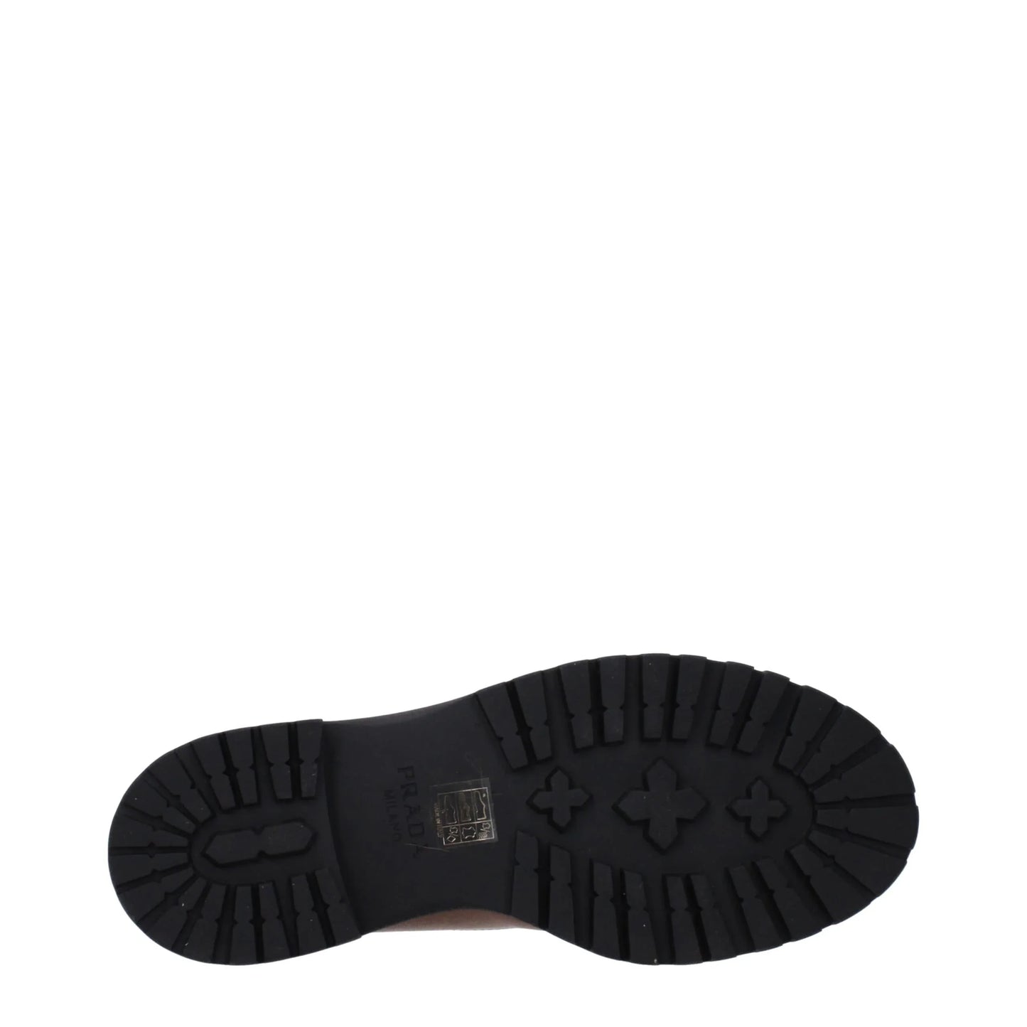 Black rubber lug sole with branding details, viewed from the bottom on white background