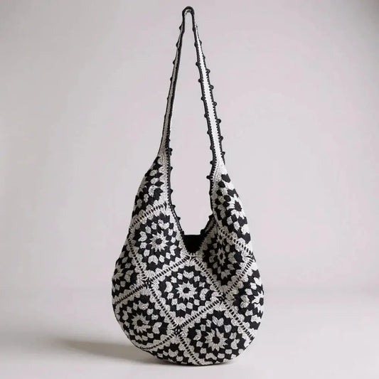 Black and white hand-woven cotton yarn shoulder bag with geometric crochet pattern