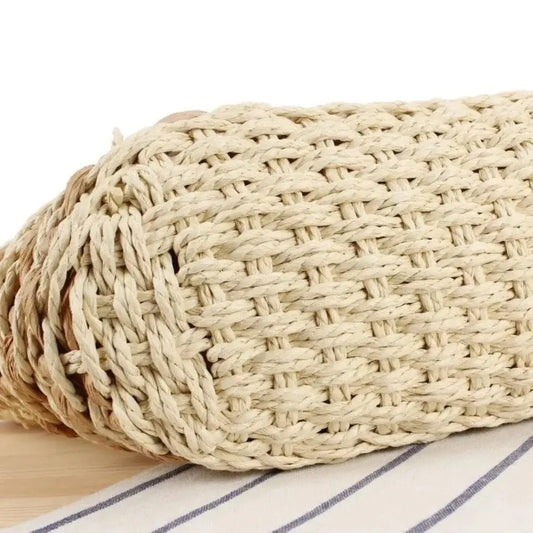 Closeup of large handmade woven straw beach bag with textured pattern