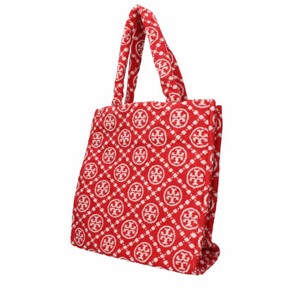 Red and white patterned designer tote bag with fabric handles, luxury accessory