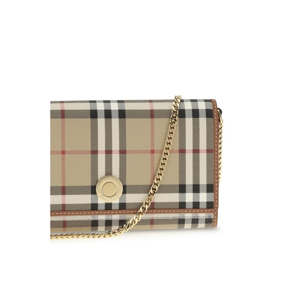 Beige plaid designer crossbody bag with gold chain strap and snap button closure