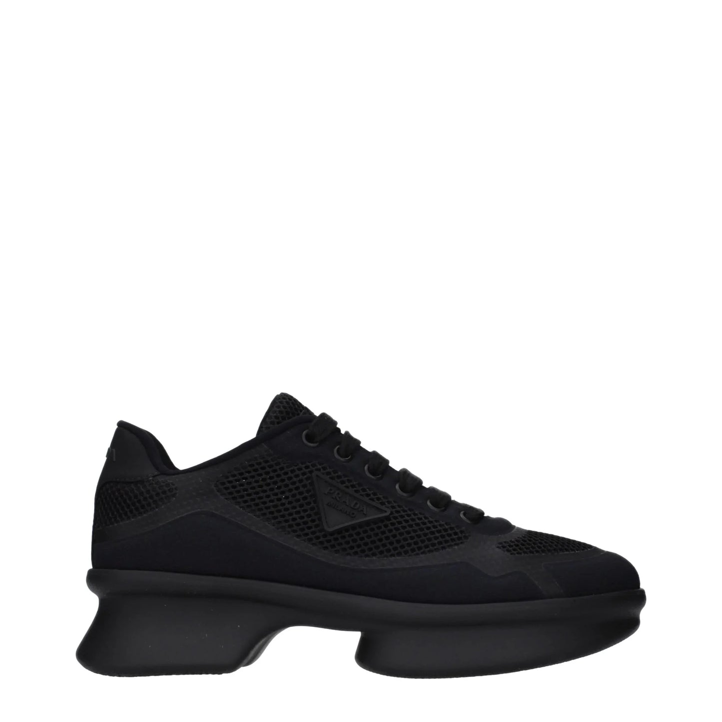 Black designer sneaker with mesh panels and chunky sole, side logo detail visible