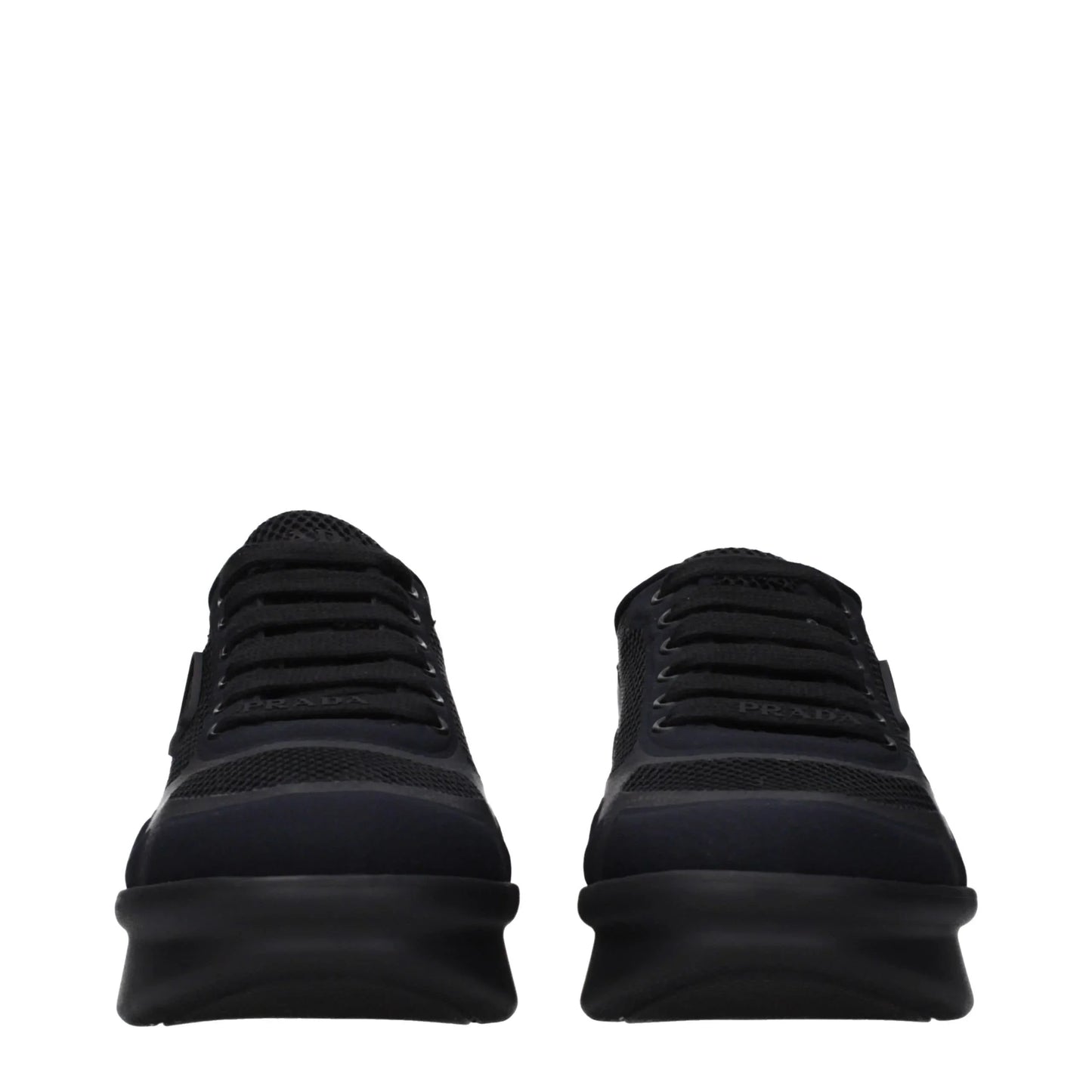 Front view of black designer mesh sneakers with chunky rubber soles and lace-up closure