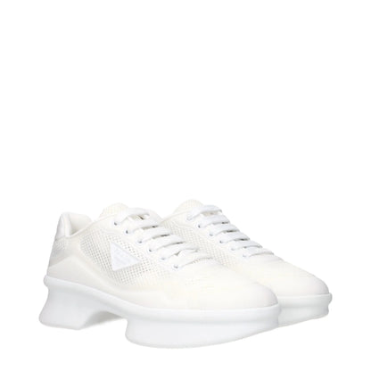 White mesh low-top sneakers with chunky sole and lace-up front on white background