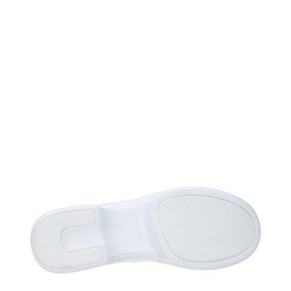 Close-up of a white rubber shoe sole with textured grip pattern on plain background