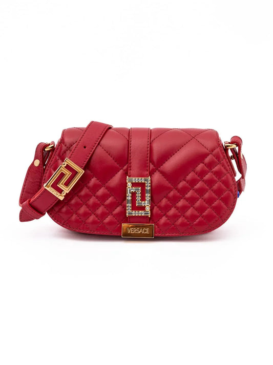Red quilted designer shoulder bag with gold hardware and decorative buckle