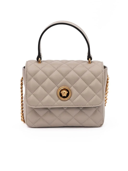 Taupe quilted leather top handle bag with gold chain strap and gold medallion clasp