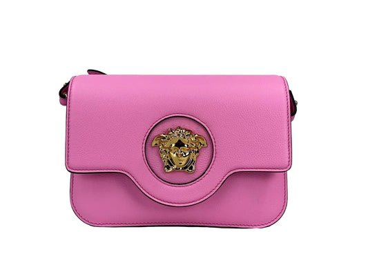 Pink leather shoulder bag with gold Medusa head emblem and flap closure