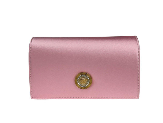 Pink satin designer clutch bag with gold and crystal medallion detail