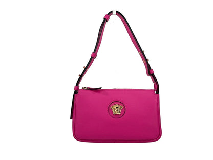 Pink leather designer shoulder bag with gold medallion detail and adjustable strap