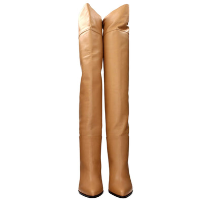 Tan leather thigh-high boots with pointed toes on a white background