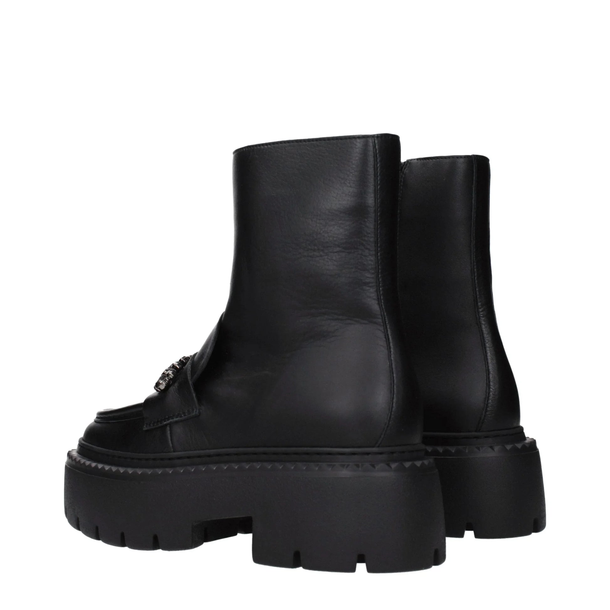 Black leather ankle boots with chunky lug sole and metal detail, side view
