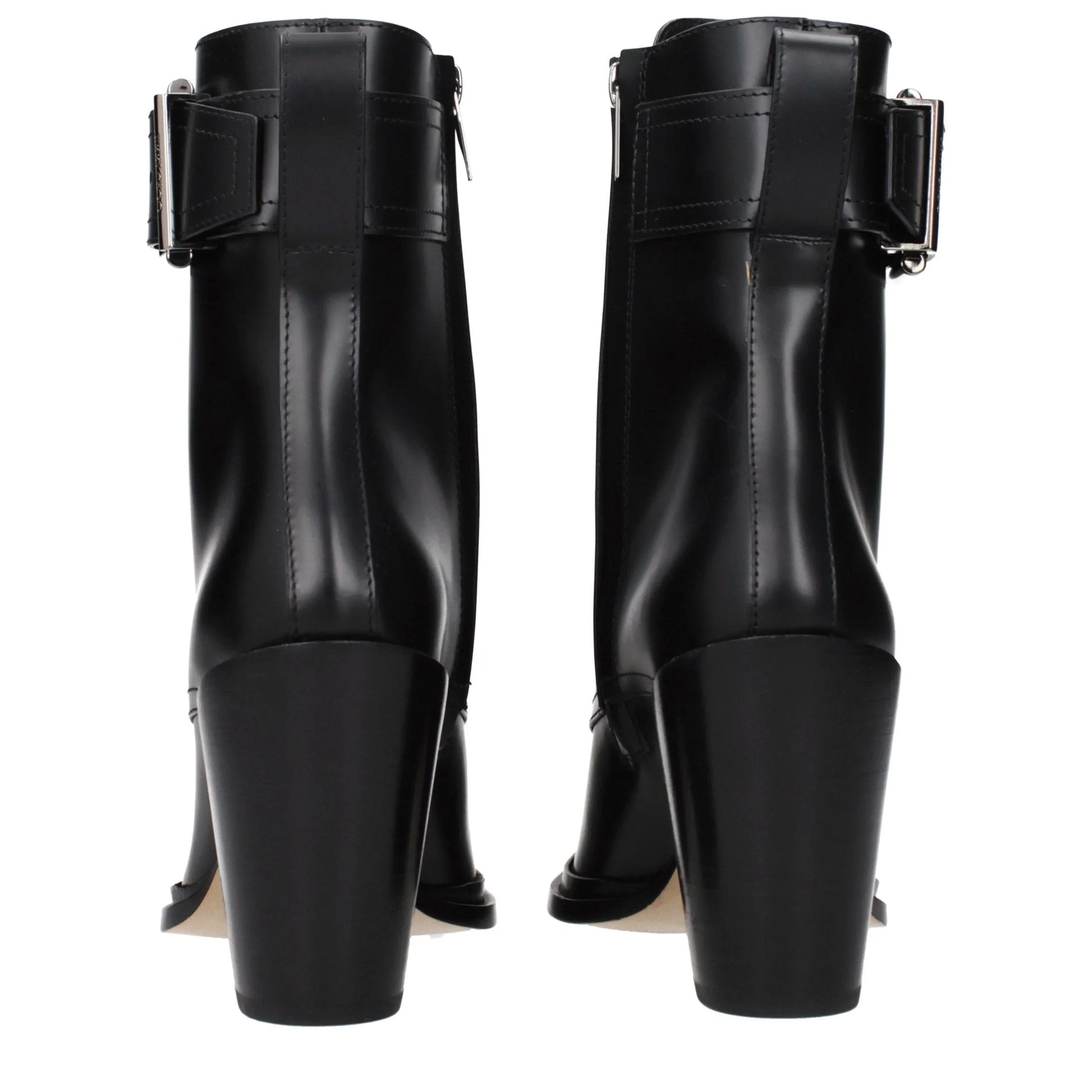 Back view of black leather heeled ankle boots with buckle detail
