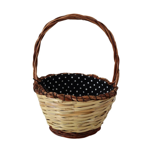 Wicker basket with handle, lined with black and white polka dot fabric