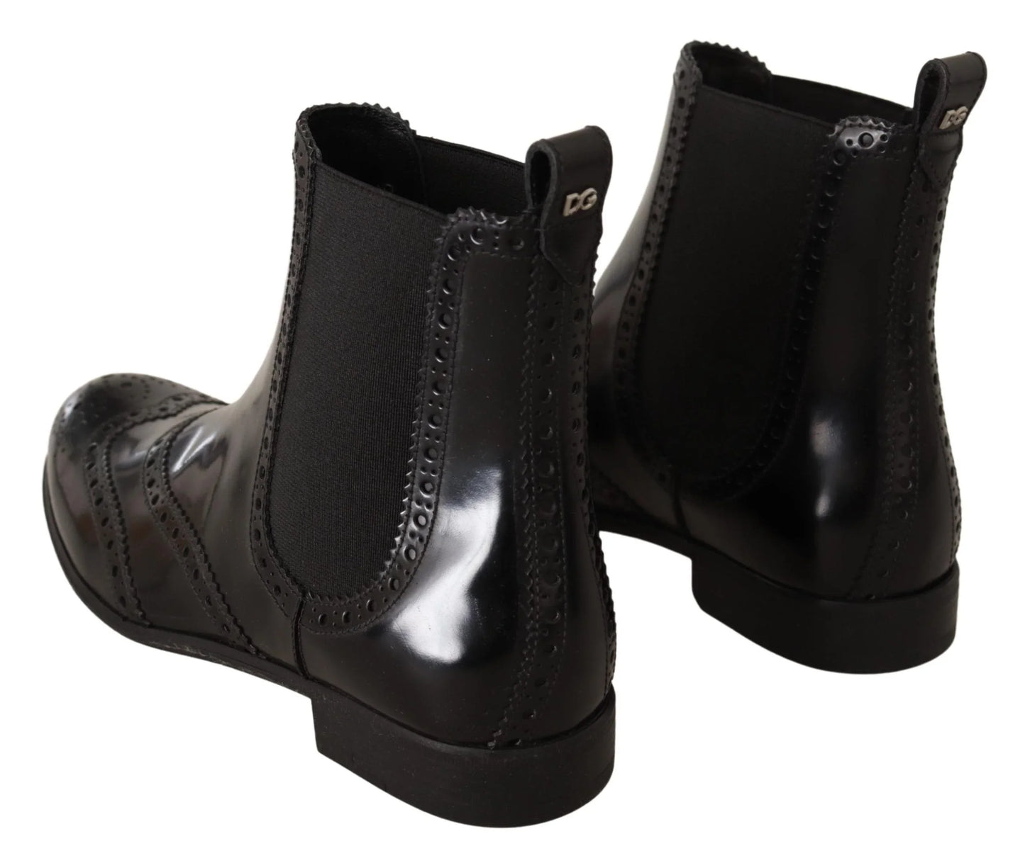 Black leather Chelsea boots with brogue detailing and elastic side panels, rear view