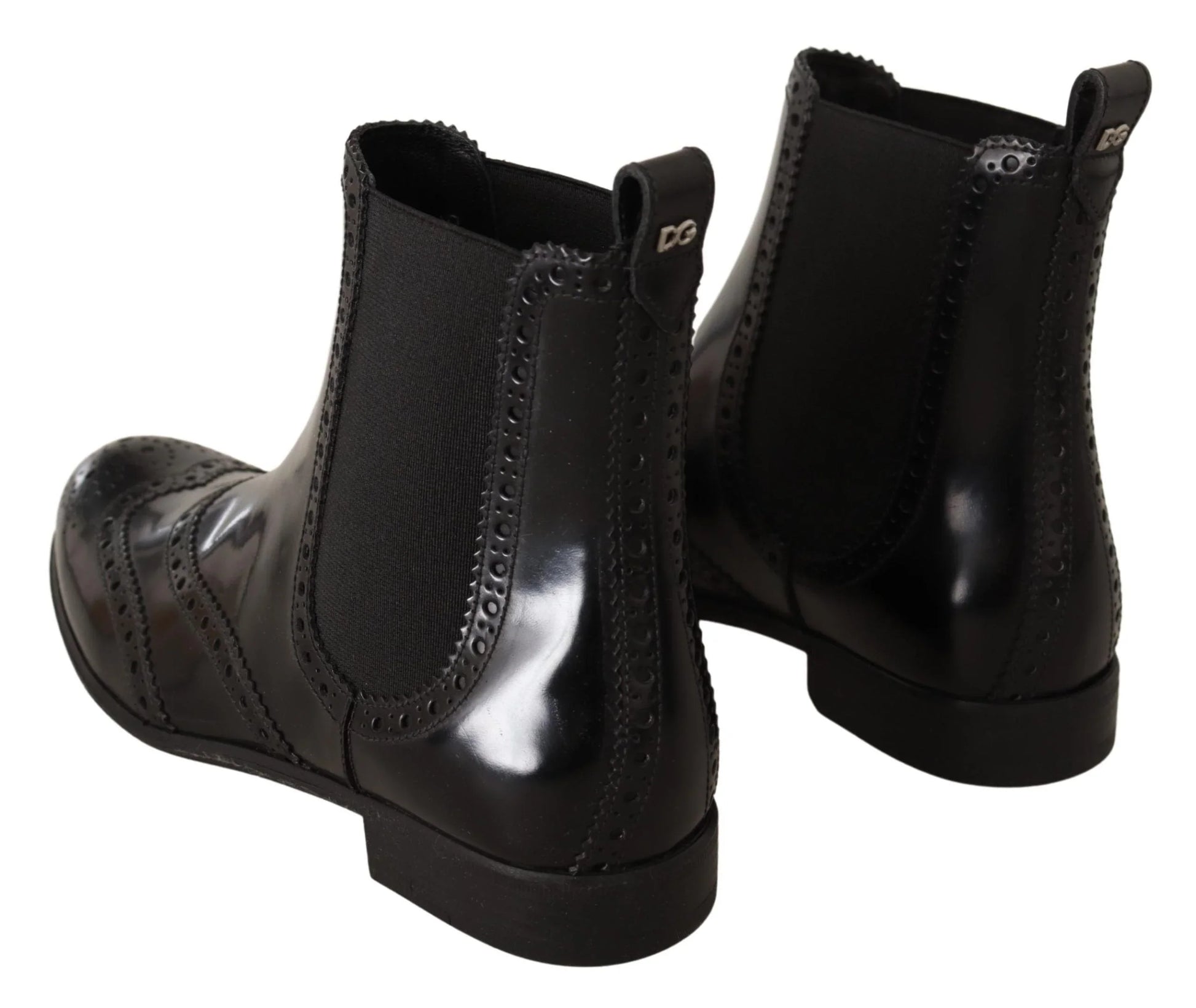 Black leather Chelsea boots with brogue detailing and elastic side panels, rear view