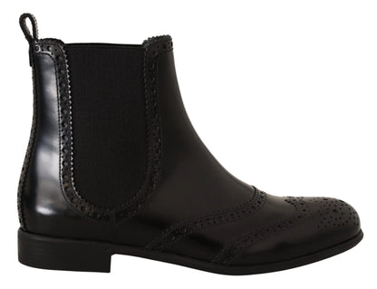Black leather Chelsea boot with brogue detailing and elastic side panel