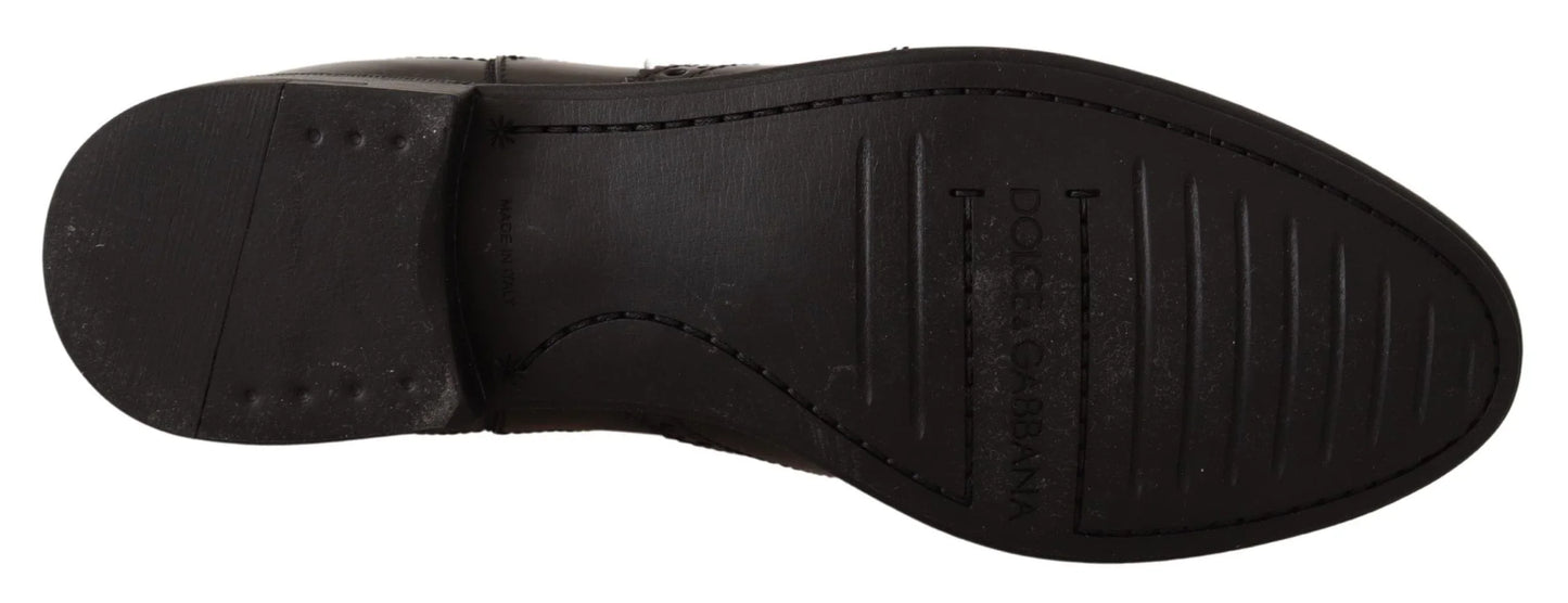 Bottom view of black leather dress shoe sole with stitched detail and textured grip