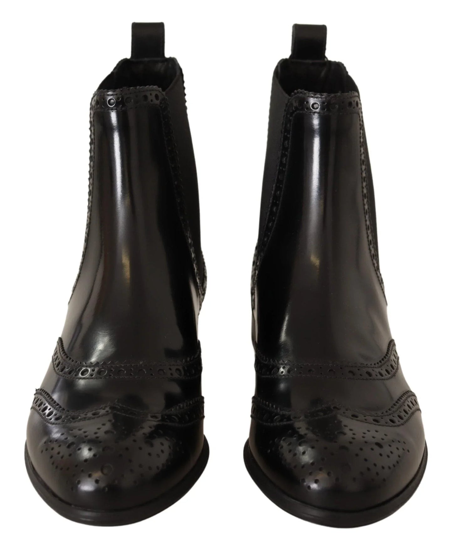 Front view of black leather brogue ankle boots with decorative perforated detailing
