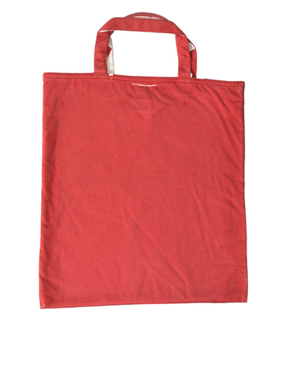 Red cotton tote bag with double handles, flat and unadorned, on white background