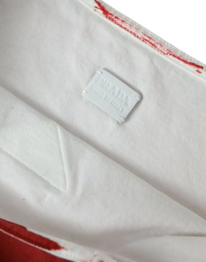 White fabric interior with stitched tag reading 'PRADA Made in Italy', red trim detail