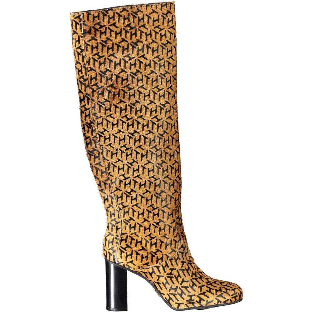 Tan knee-high leather boot with black geometric pattern and block heel