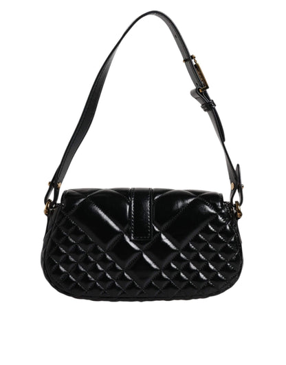 Black quilted leather shoulder bag with adjustable strap and gold hardware
