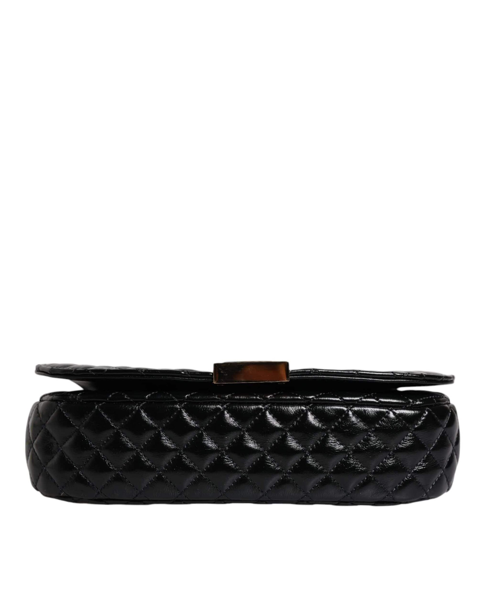 Black quilted leather designer bag with gold clasp on white background