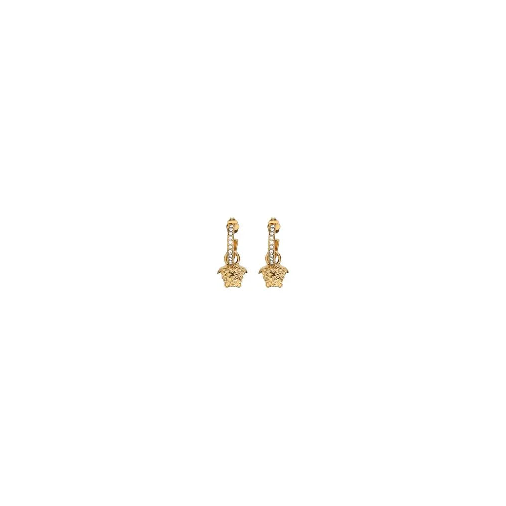 Gold Medusa drop earrings with crystal accents on white background