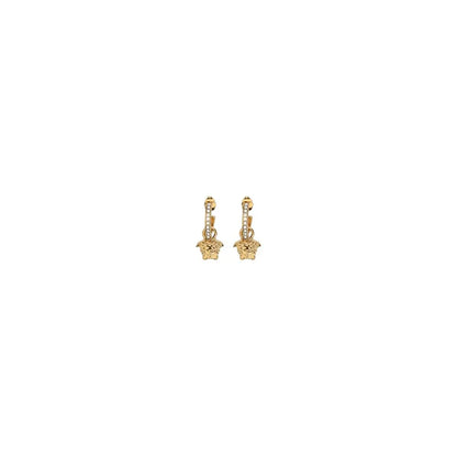 Gold Medusa drop earrings with crystal accents on white background