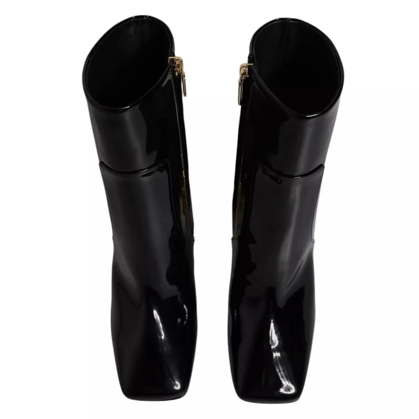 Pair of black patent leather square-toe boots with side zippers, luxury footwear