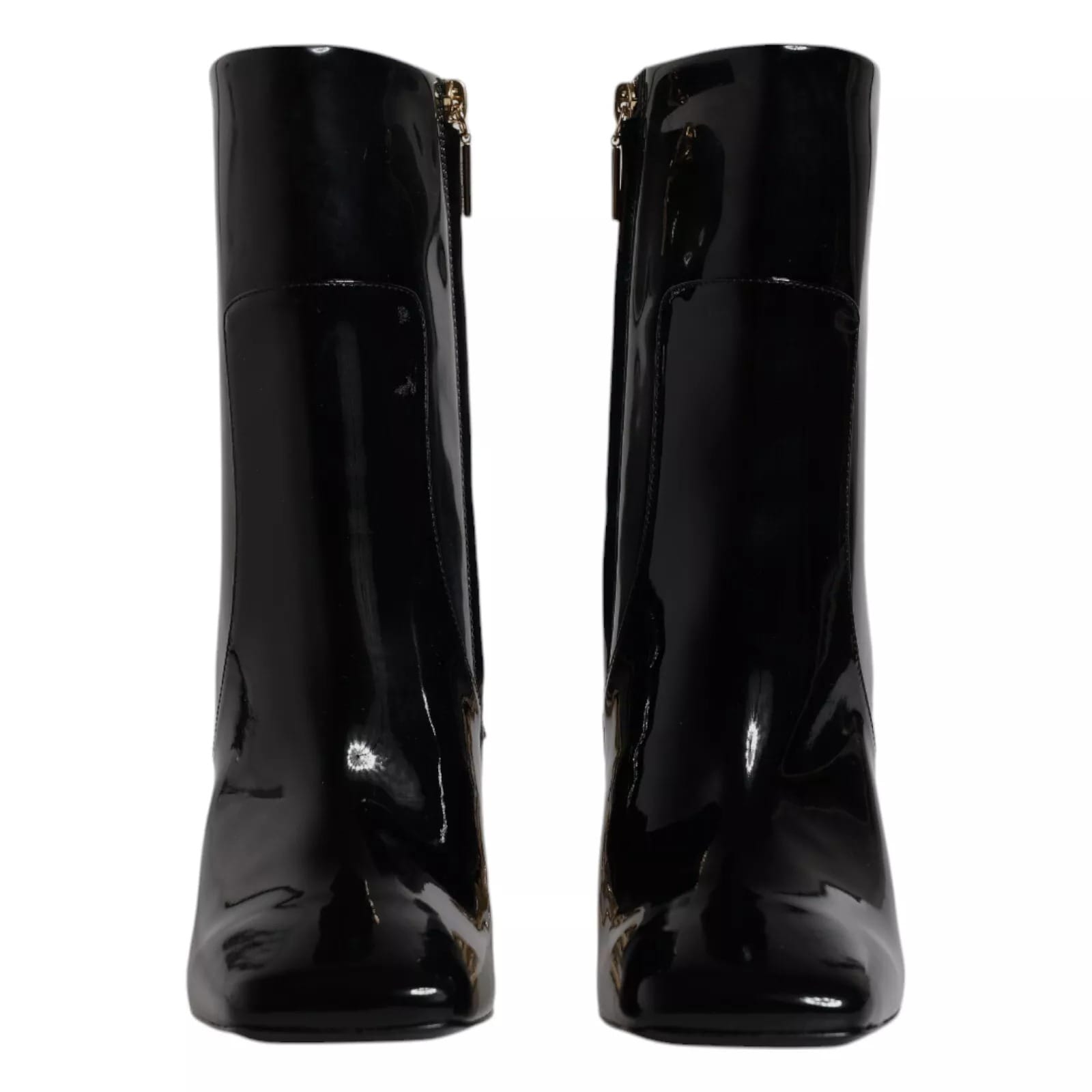 Black patent leather ankle boots with square toes and gold side zippers, front view