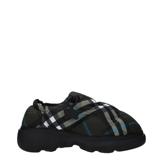 Chunky sole slip-on sneaker with black, white, and teal plaid pattern, side view