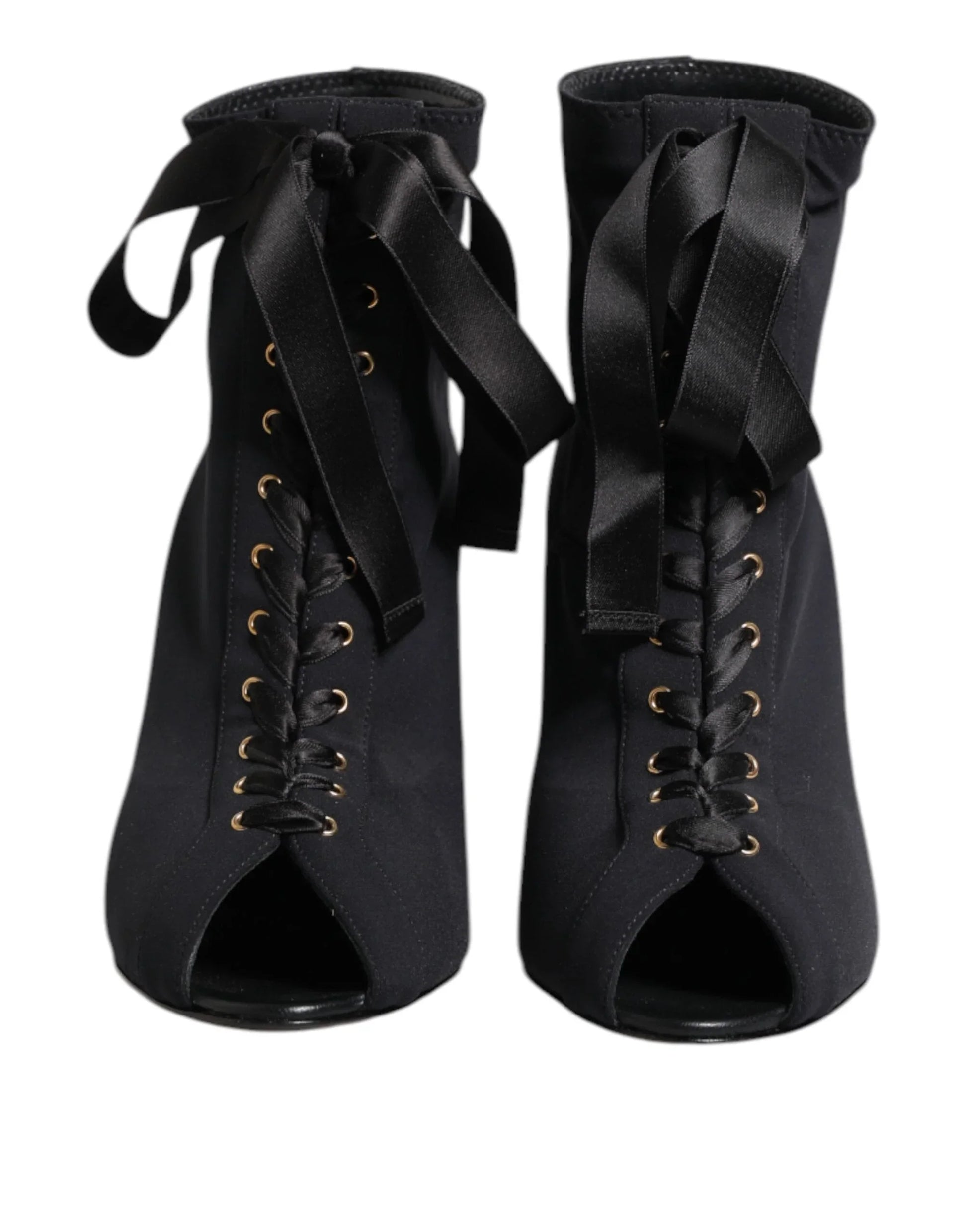 Black lace-up peep toe booties with satin ribbon ties, front view on white background