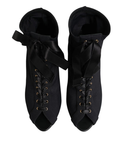 Black lace-up peep toe ankle boots with satin ribbon detail, viewed from above
