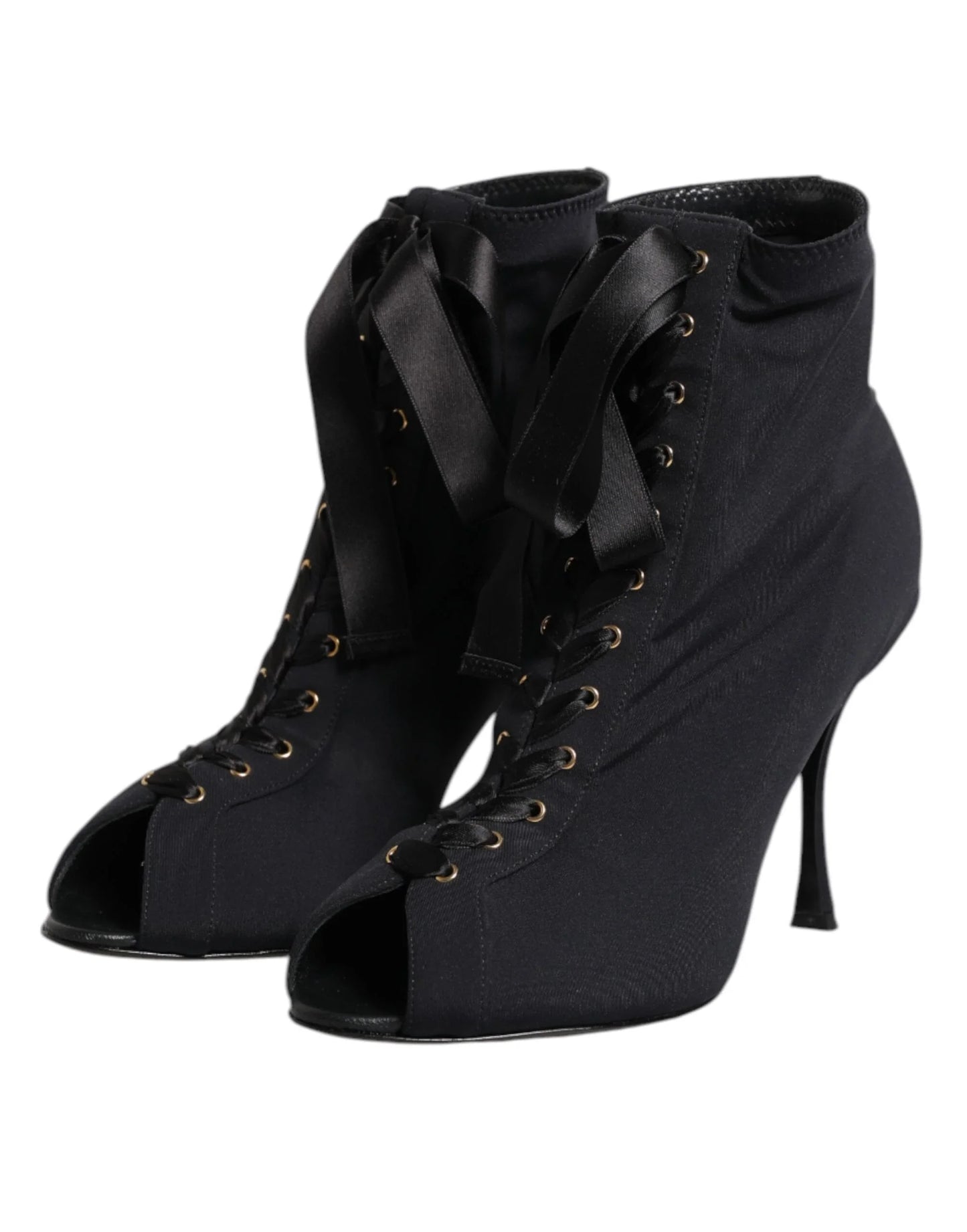 Black lace-up peep toe stiletto ankle boots with ribbon laces on a white background
