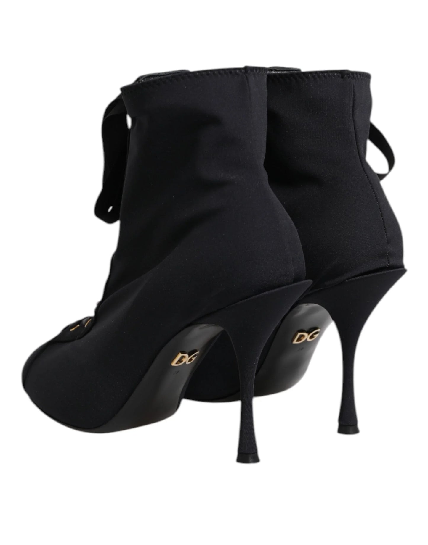 Black stiletto sock boots with gold logo heel detail and pointed toe, luxury footwear