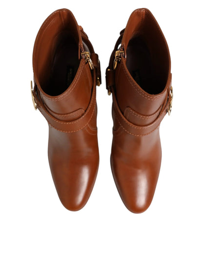 Brown leather ankle boots with gold buckle accents, top view, luxury women's footwear