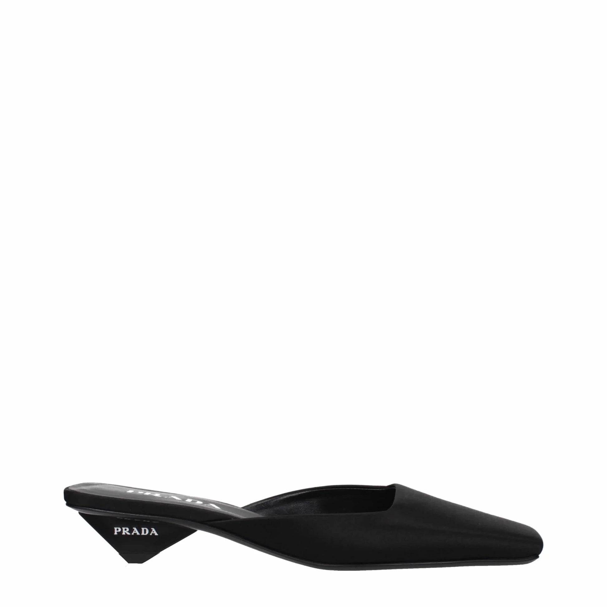 Black pointed-toe mule with low geometric heel and visible logo on the heel side