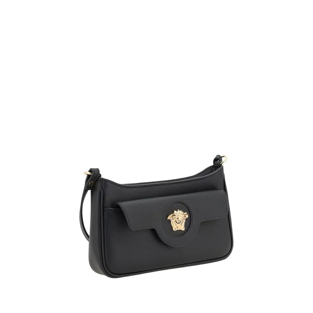 Black leather designer shoulder bag with gold Medusa emblem and flap closure