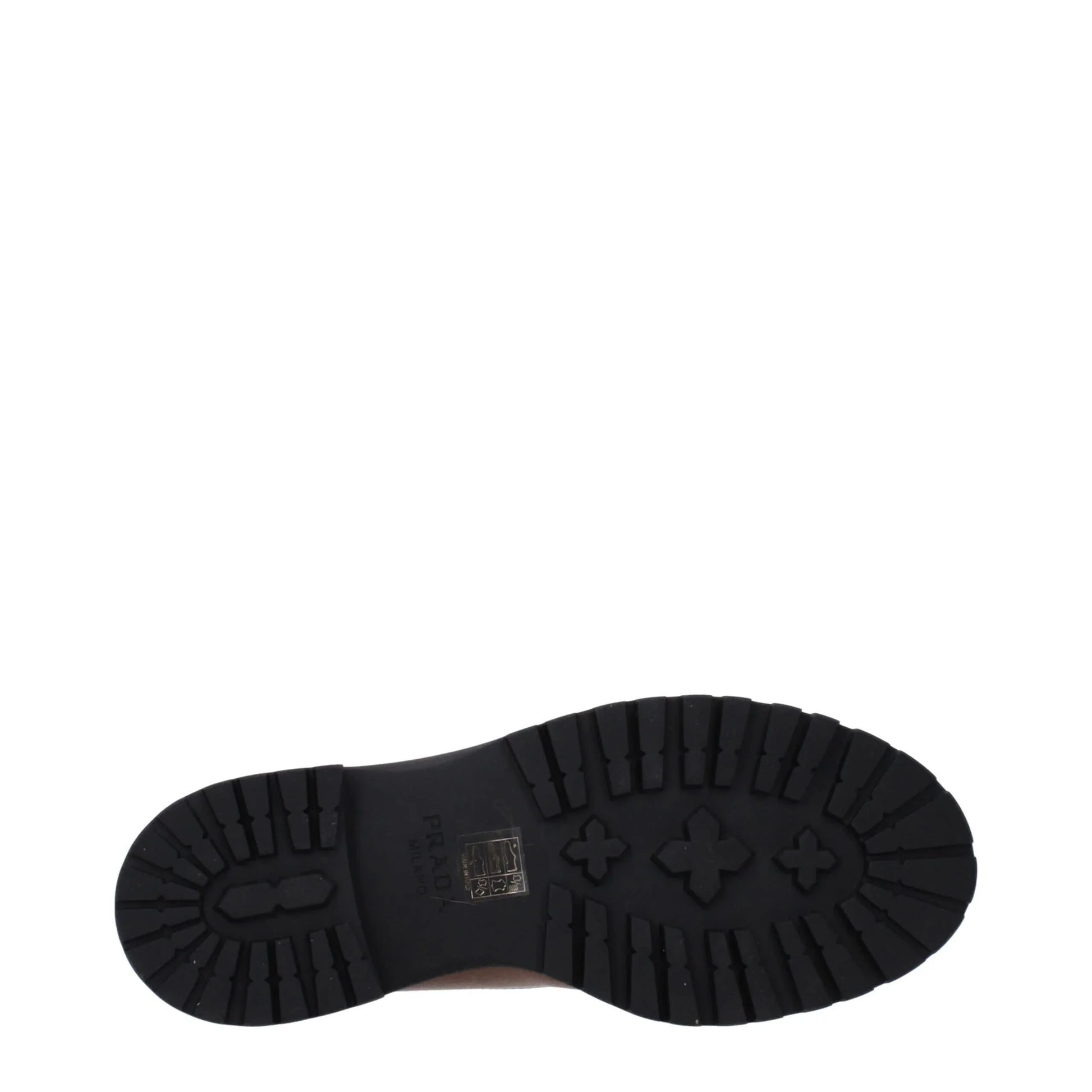 Black rubber lug sole with branding details, viewed from the bottom on white background