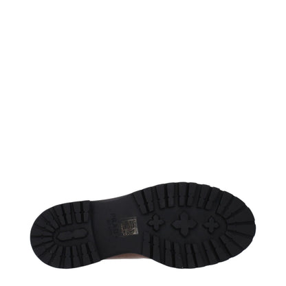 Black rubber lug sole with branding details, viewed from the bottom on white background