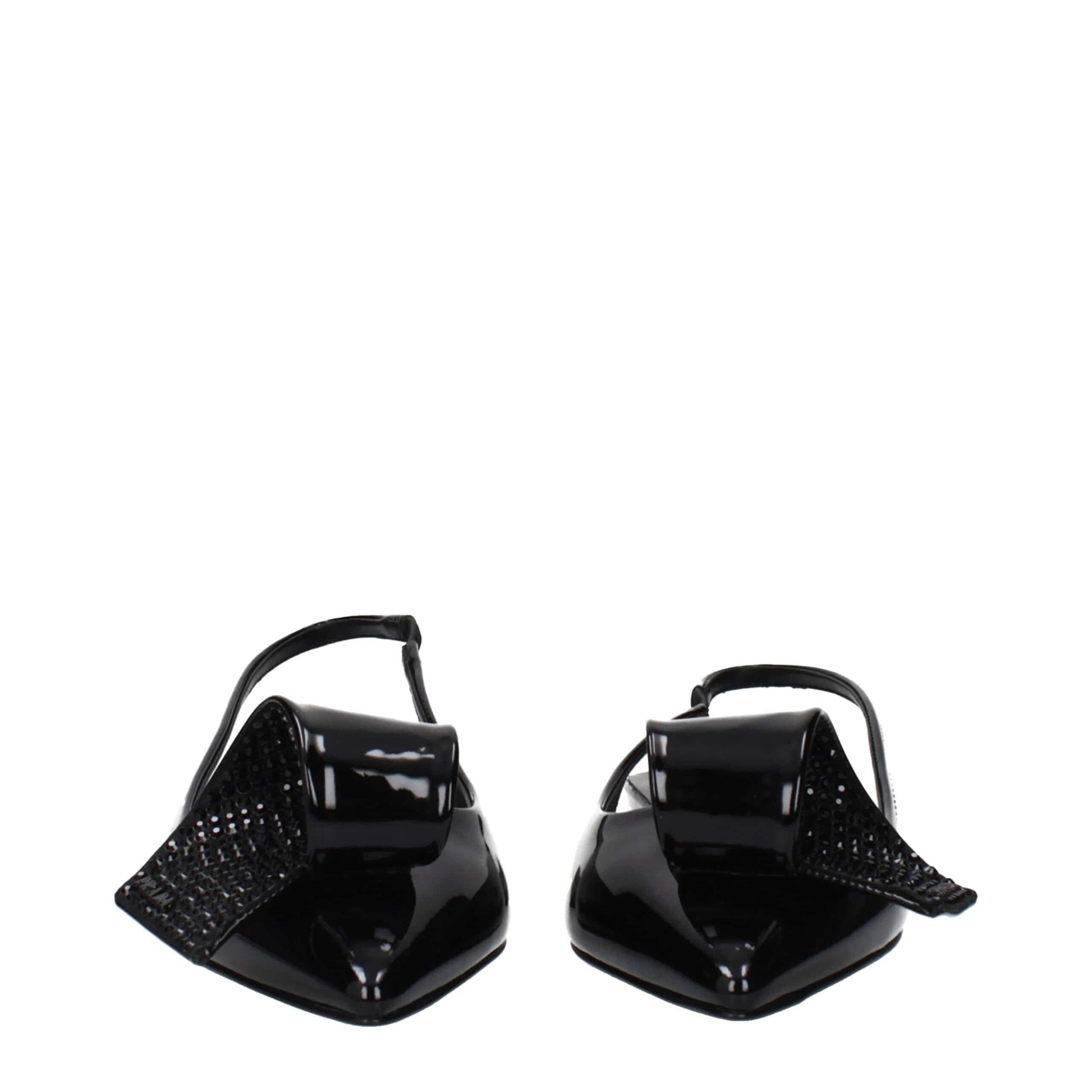 Black patent leather slingbacks with pointed toes and oversized decorative bows