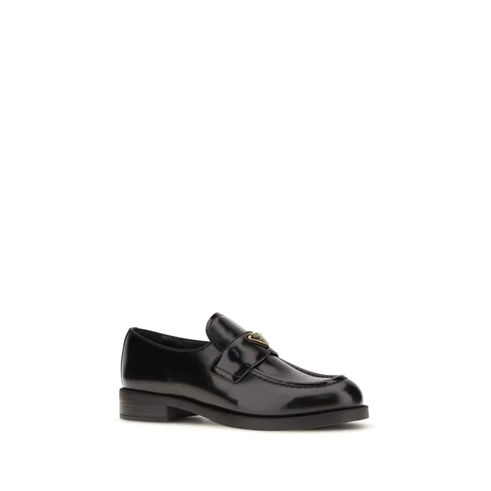 Black leather loafer with gold buckle detail, classic slip-on designer shoe