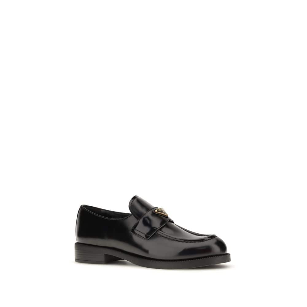 Black leather loafer with gold buckle detail, classic slip-on designer shoe