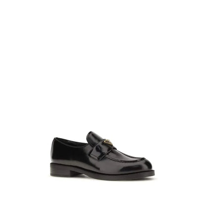 Black leather loafer with gold buckle detail, classic slip-on designer shoe