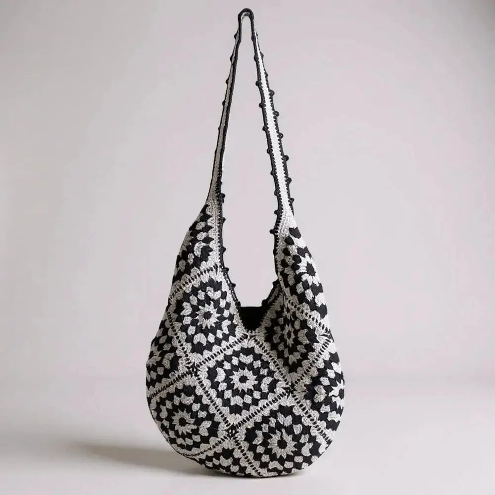 Black and white hand-woven cotton yarn shoulder bag with geometric crochet pattern